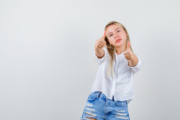 Young blonde woman in a white shirt