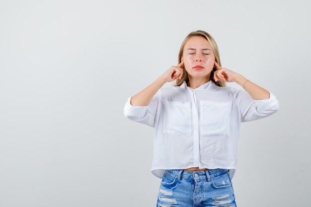 Young blonde woman in a white shirt