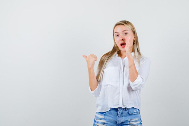 Young blonde woman in a white shirt