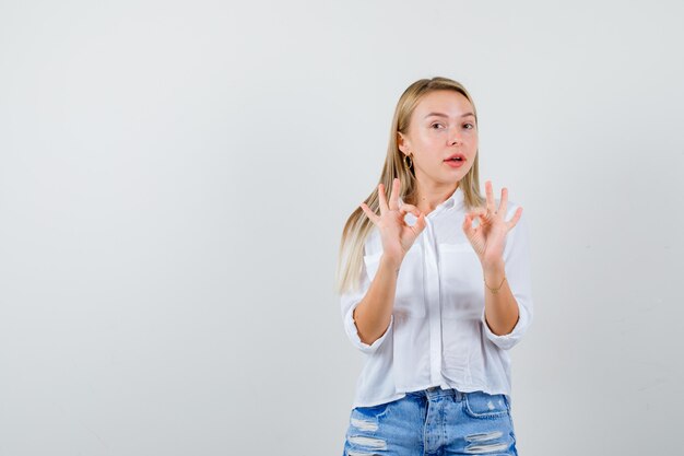 Young blonde woman in a white shirt