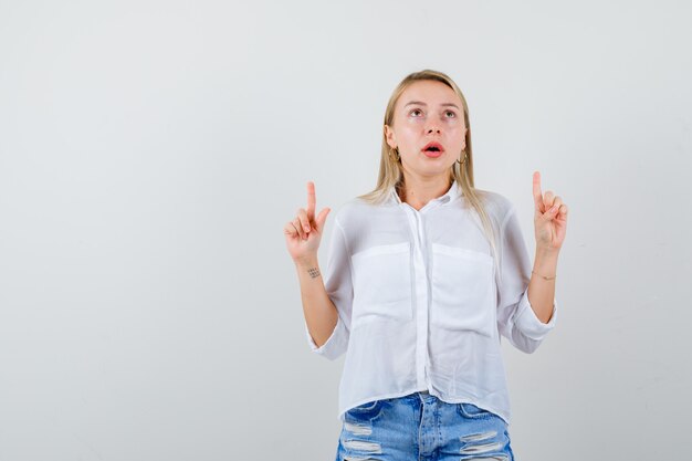 Young blonde woman in a white shirt