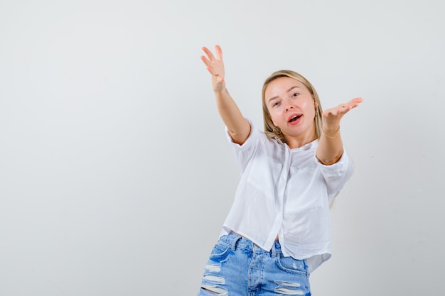 Young blonde woman in a white shirt