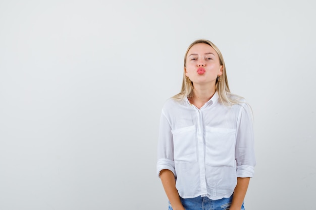 Young blonde woman in a white shirt