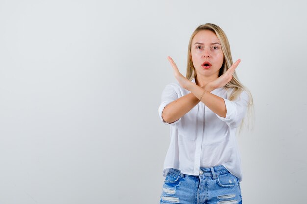 Young blonde woman in a white shirt