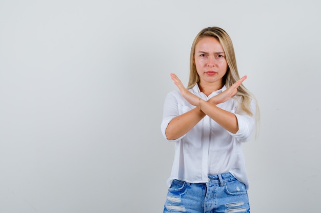 Young blonde woman in a white shirt