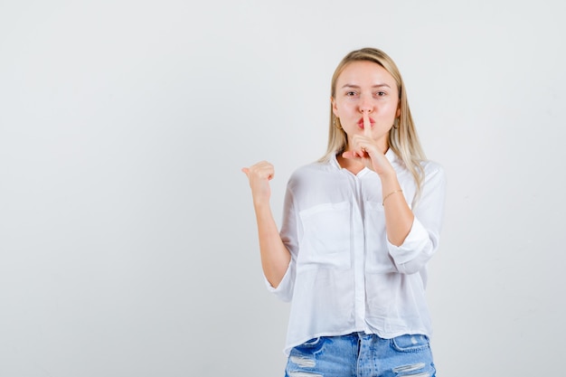 Young blonde woman in a white shirt