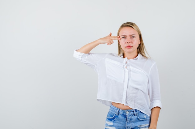 Young blonde woman in a white shirt