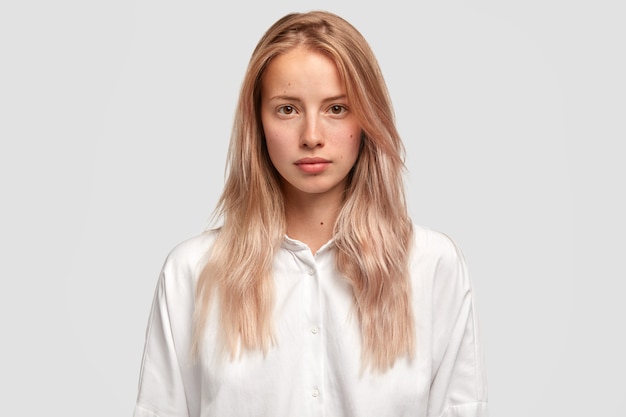 Young blonde woman in white shirt