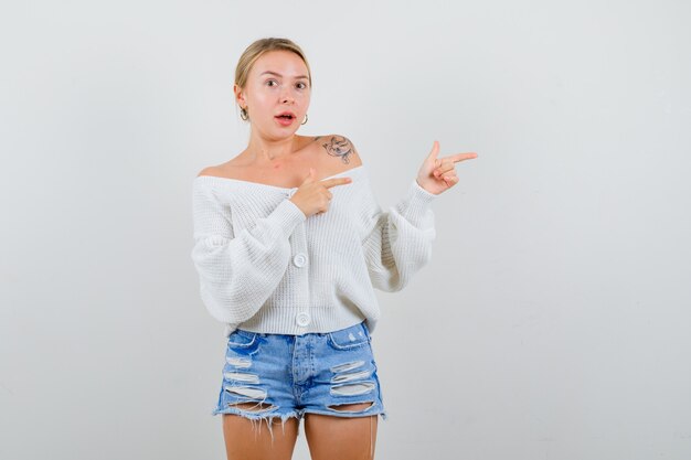 Young blonde woman in a white sweater