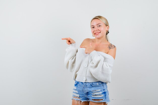 Young blonde woman in a white sweater