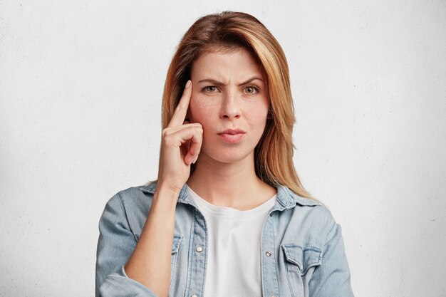 Young blonde woman with denim shirt