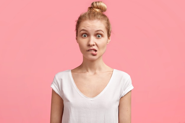 Young blonde woman with hair in a bun