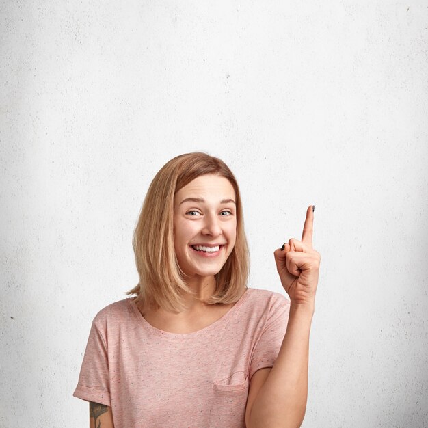 Young blonde woman with pink T-shirt