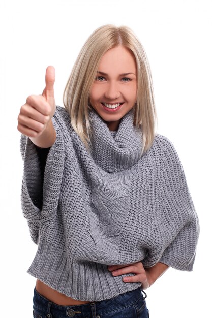 Young blonde woman with thumbs up