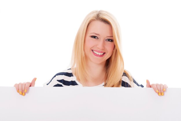 Young blonde woman with whiteboard