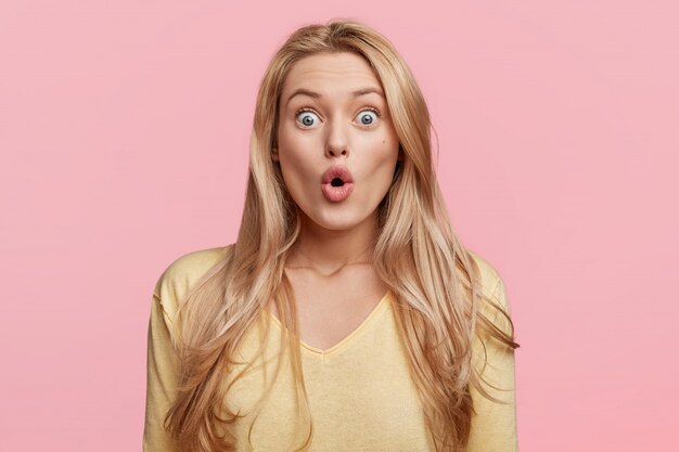 Young blonde woman with yellow shirt