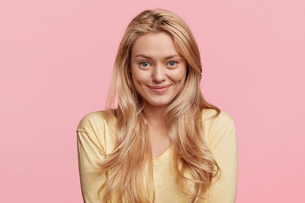 Young blonde woman with yellow shirt