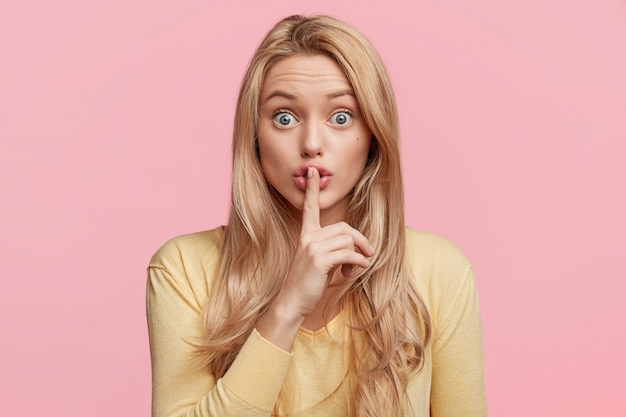 young blonde woman with yellow shirt