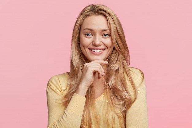 Young blonde woman with yellow shirt