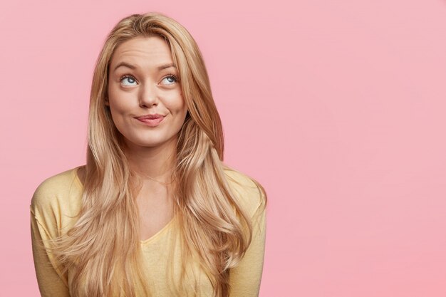 Young blonde woman with yellow shirt