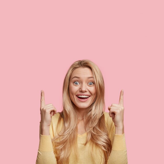 Young blonde woman with yellow shirt