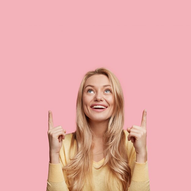 Young blonde woman with yellow sweater