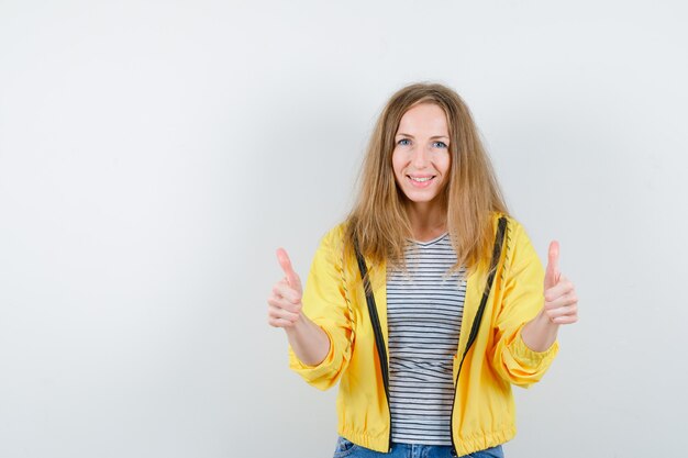 Young blonde woman in a yellow jacket