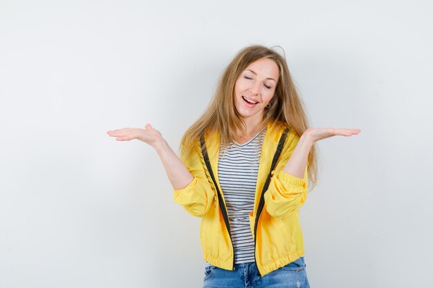 Young blonde woman in a yellow jacket