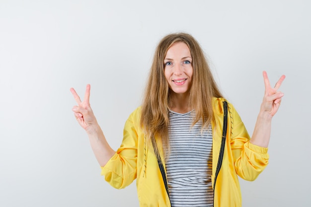 Young blonde woman in a yellow jacket