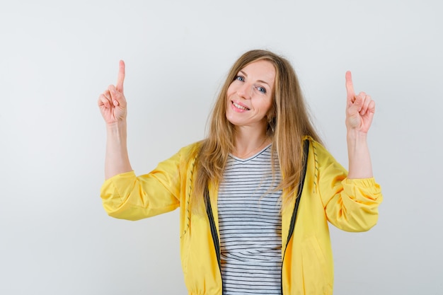 Young blonde woman in a yellow jacket