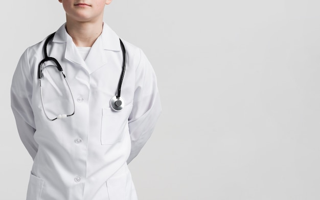 Young boy dressed up as medic with copy space