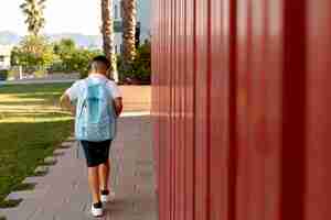 Free photo young boy getting back to school