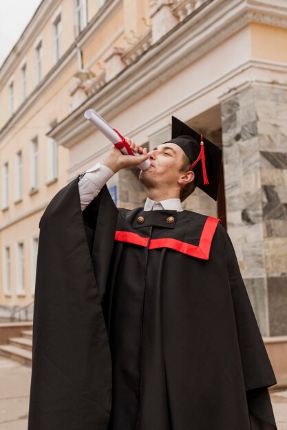 Young boy happy to graduate