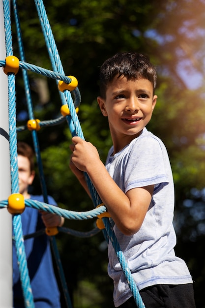 Free photo young boy having fun in the playground