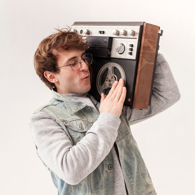 Young boy holding cassette