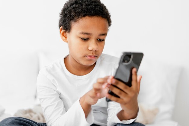 Young boy kid using mobile