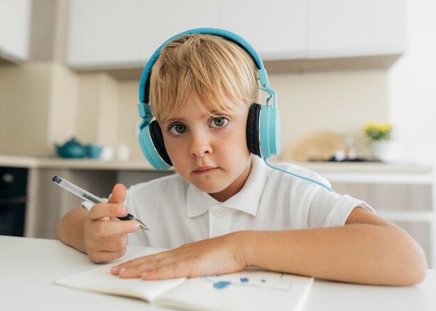 Young boy paying attention to online class