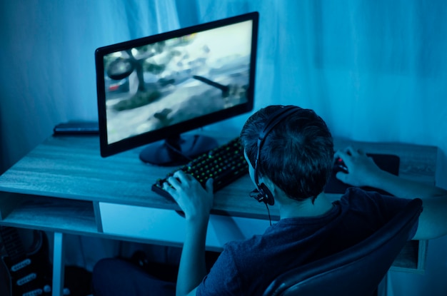 Young boy playing on computer