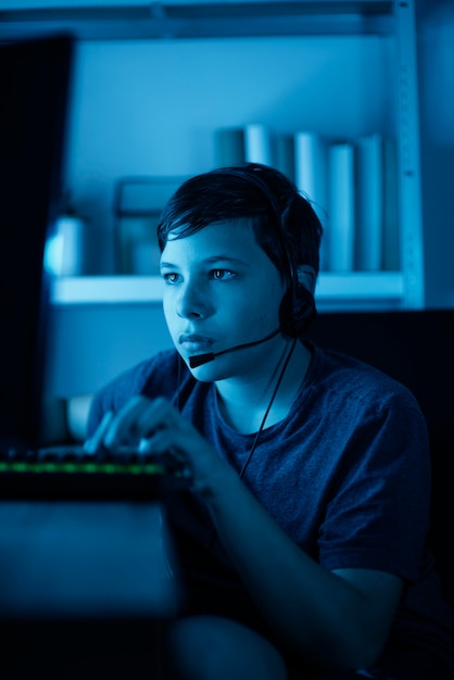 Young boy playing on computer