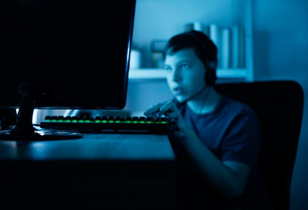 Young boy playing on computer