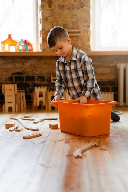 Young boy playing indoors with eco toys