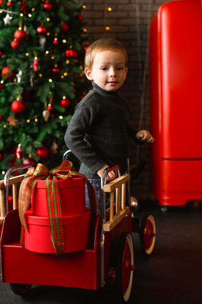 Young boy playing with christmas toys