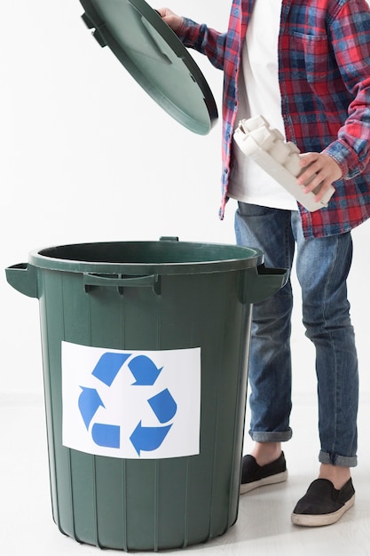 Young boy recycling products