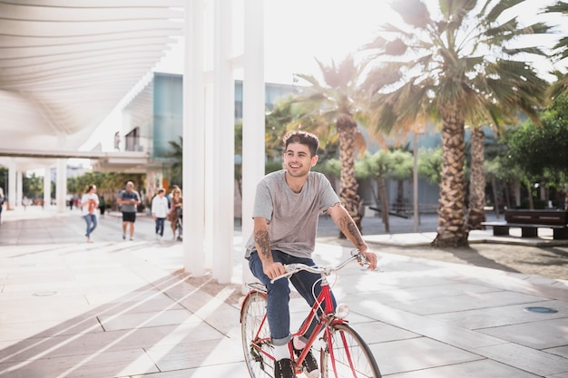 Young boy riding bike at city park