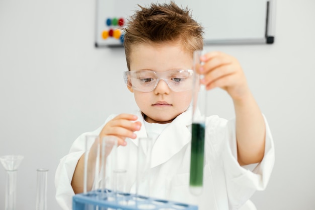 Young boy scientist doing experiments in the laboratory