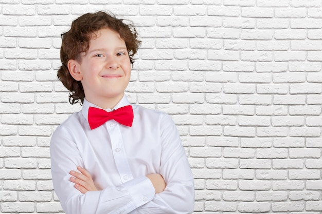 Free photo young boy in tuxedo