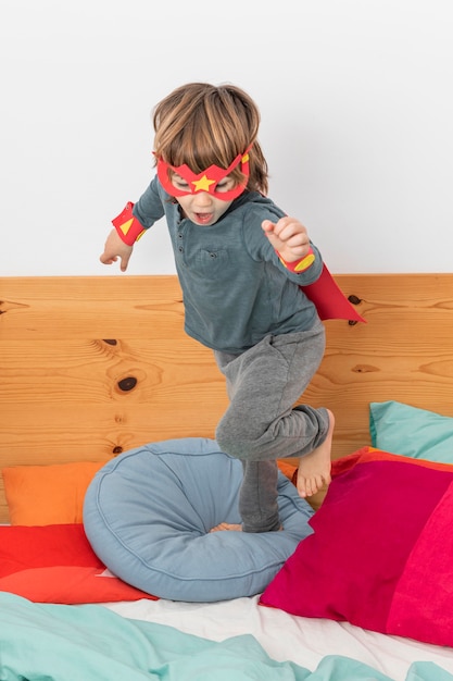 Young boy with costume playing