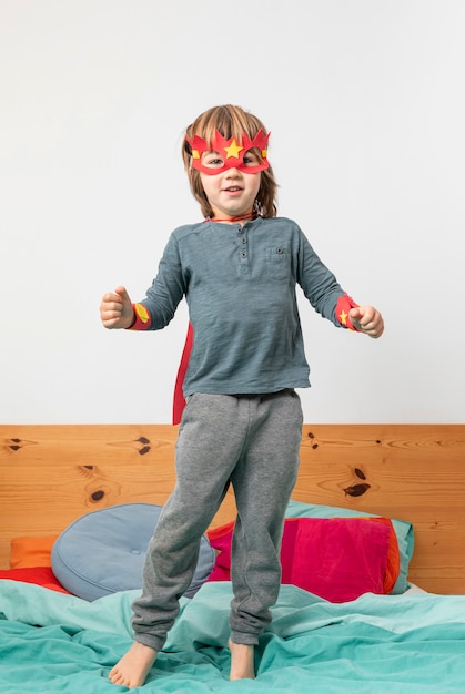 young boy with costume playing