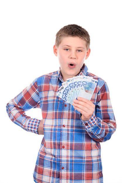 Free photo young boy with euro notes on white space