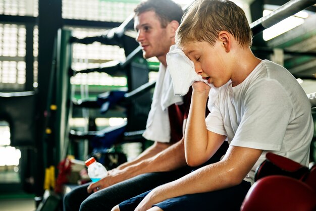 Young boy with his boxing trainer